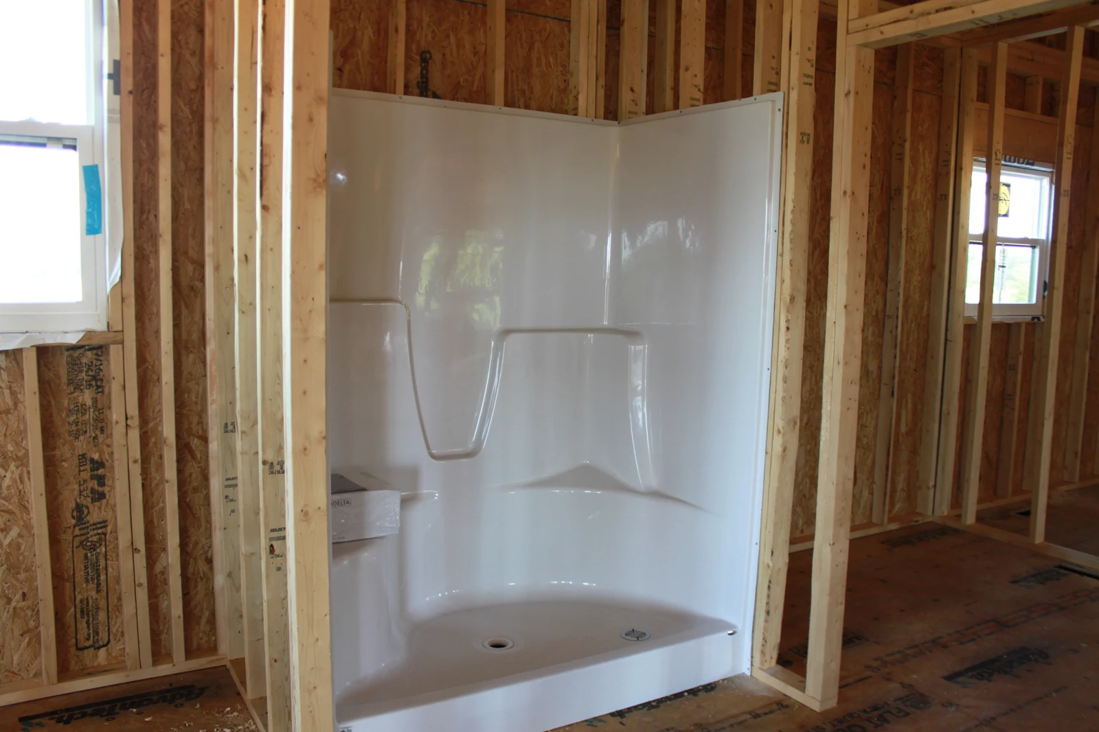 Shower enclosure set in place during construction